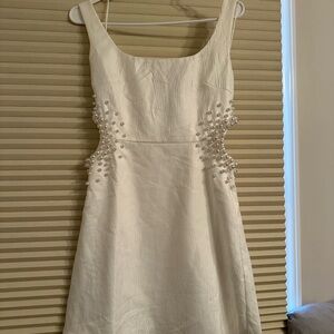 White Sleeveless Sheath Dress with Cut Out Embellishments from Francesca’s